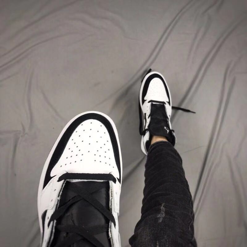 Air Jordan 1 High Sneakers in Black and White - product image from the listing.