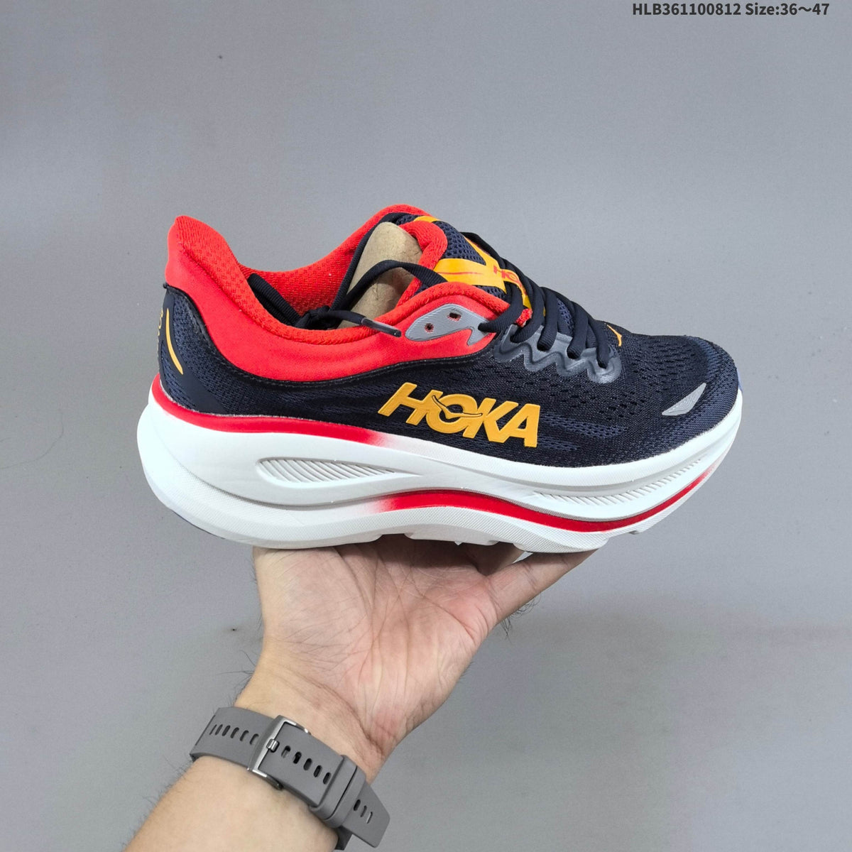 HOKA Bondi 9 Running Shoes in Navy, in Red and Yellow - product image from the listing.