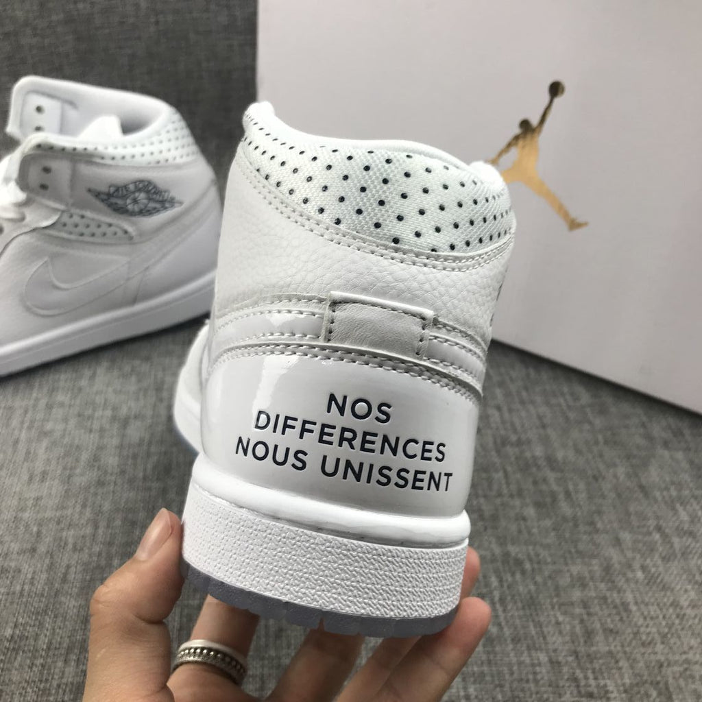 Air Jordan 1 Mid Unite Totale Sneakers in White CI9100-100 - product image from the listing.