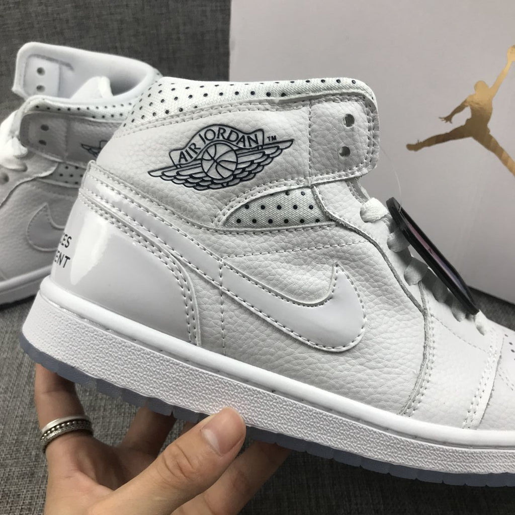 Air Jordan 1 Mid Unite Totale Sneakers in White CI9100-100 - product image from the listing.