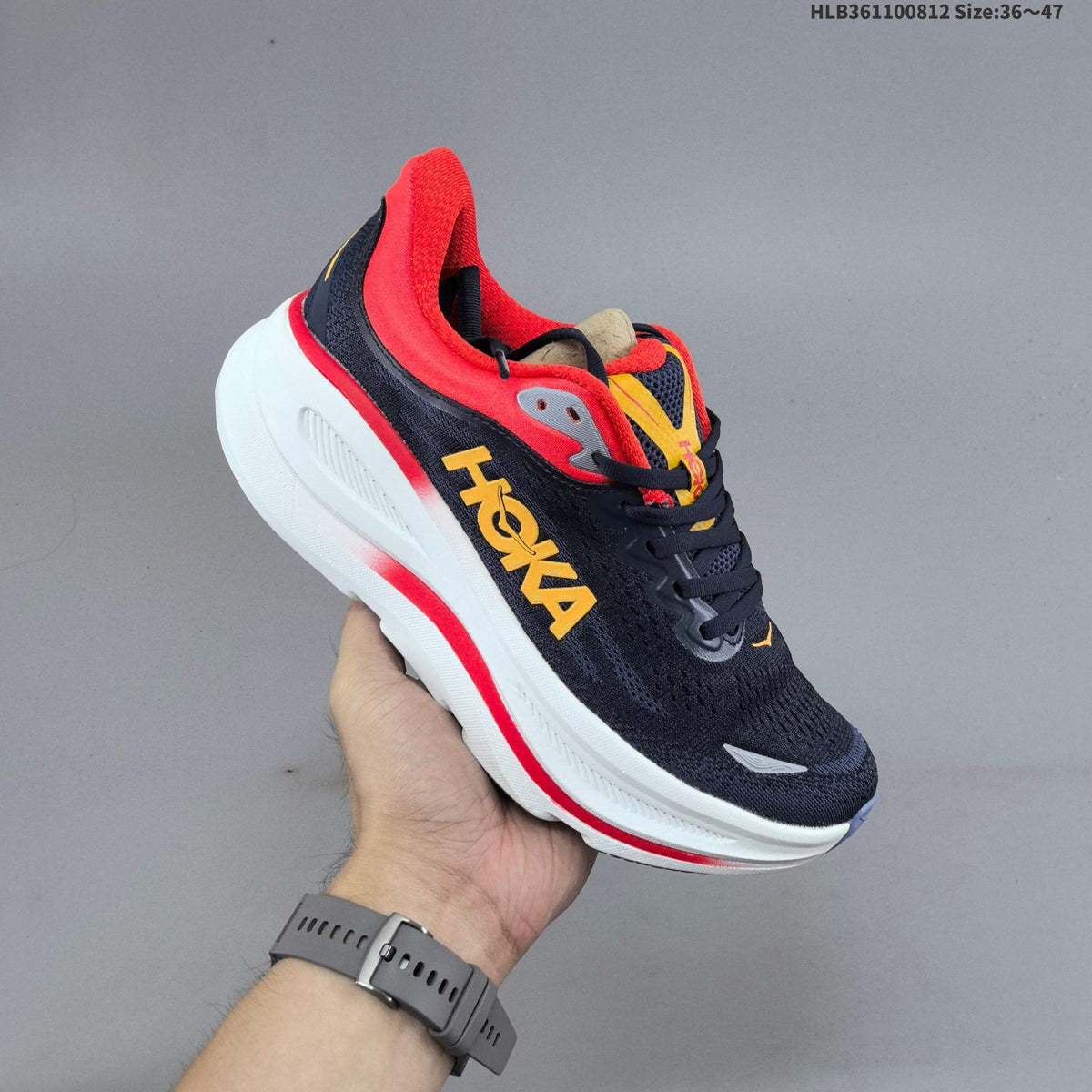 HOKA Bondi 9 Running Shoes in Navy, in Red and Yellow - product image from the listing.
