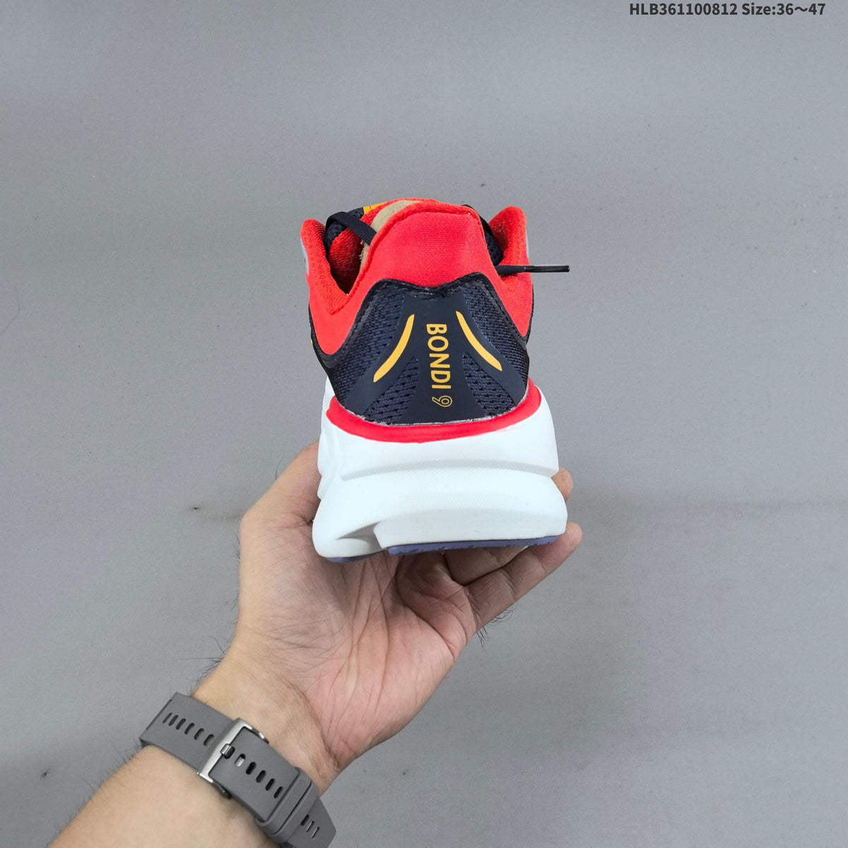HOKA Bondi 9 Running Shoes in Navy, in Red and Yellow - product image from the listing.