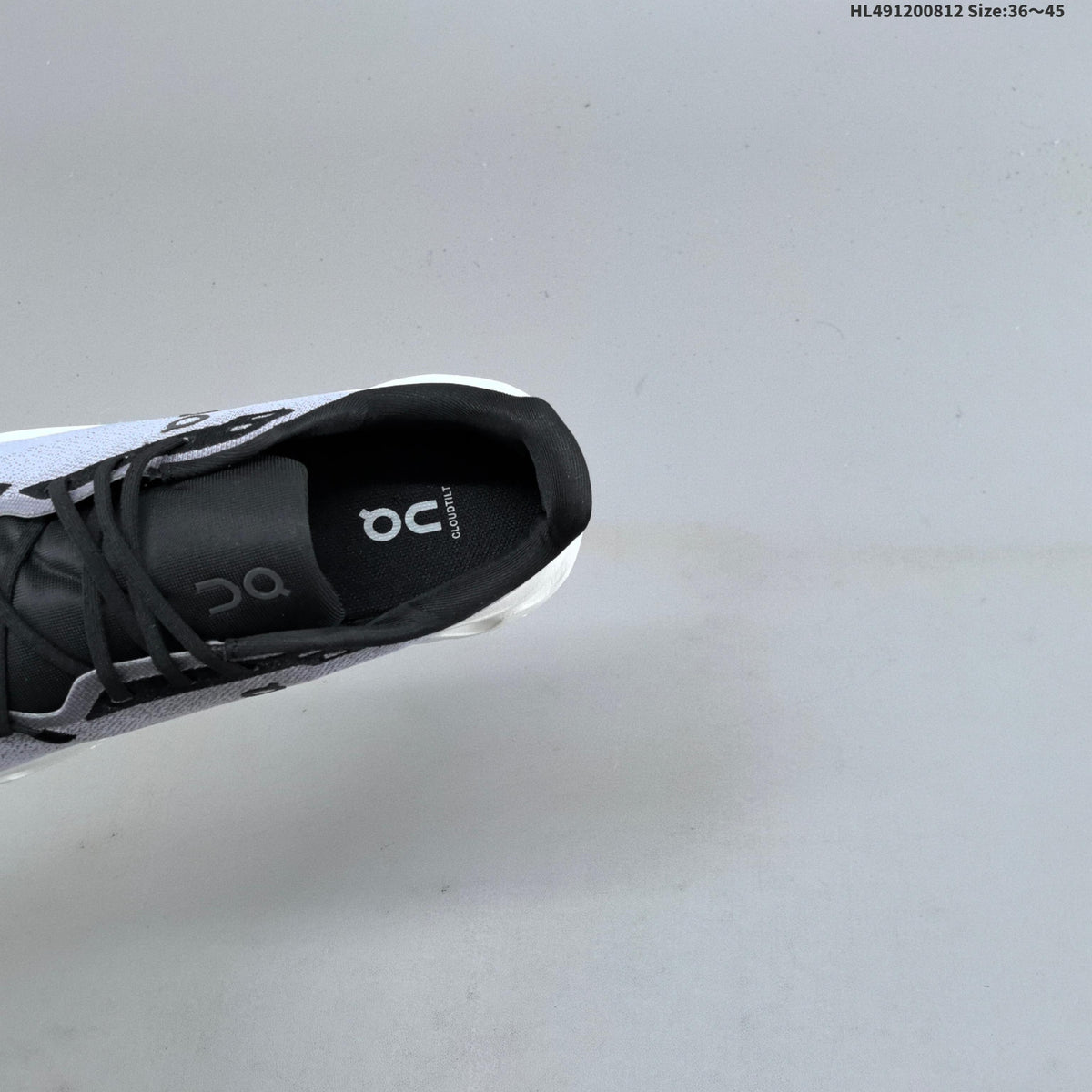 White and Black On Cloudtilt Sneakers - product image from the listing.