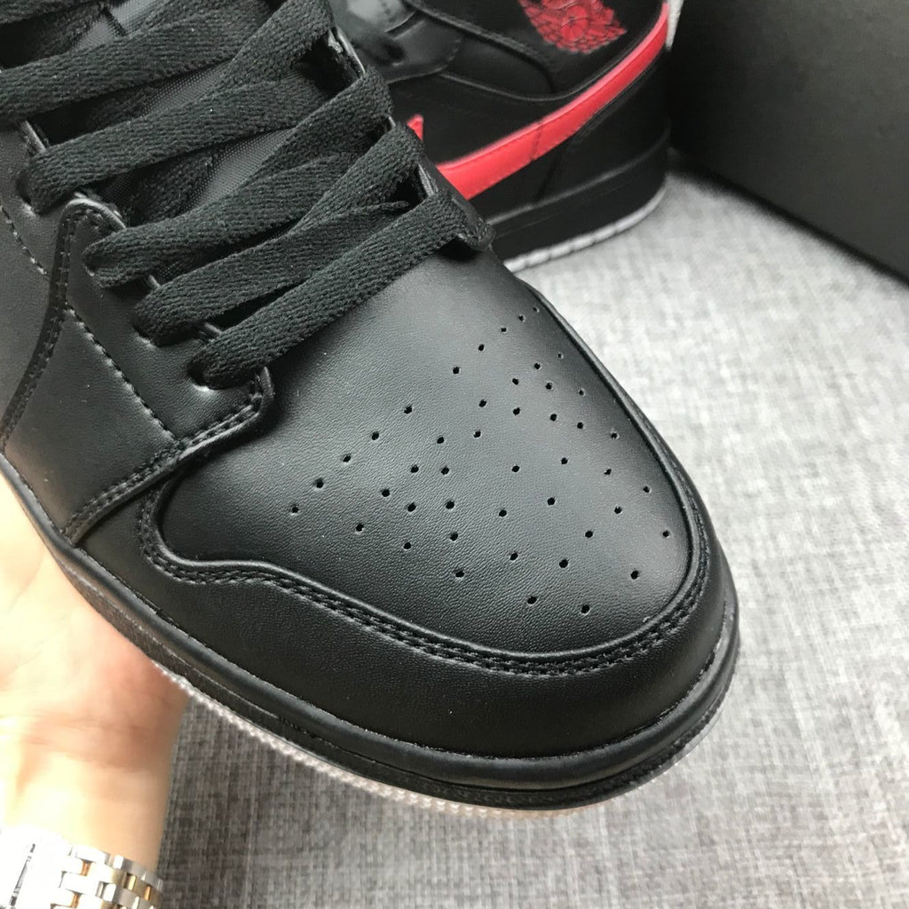 Air Jordan 1 Mid Sneakers in Black and Red 554724-045 - product image from the listing.