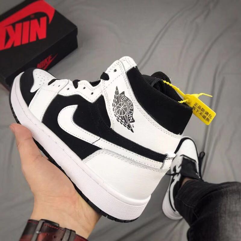 Air Jordan 1 High Sneakers in Black and White - product image from the listing.