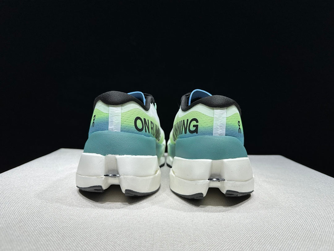 On Cloudboom Max Running Shoes, in White and Green - product image from the listing.