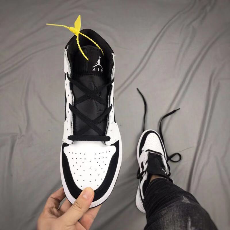 Air Jordan 1 High Sneakers in Black and White - product image from the listing.