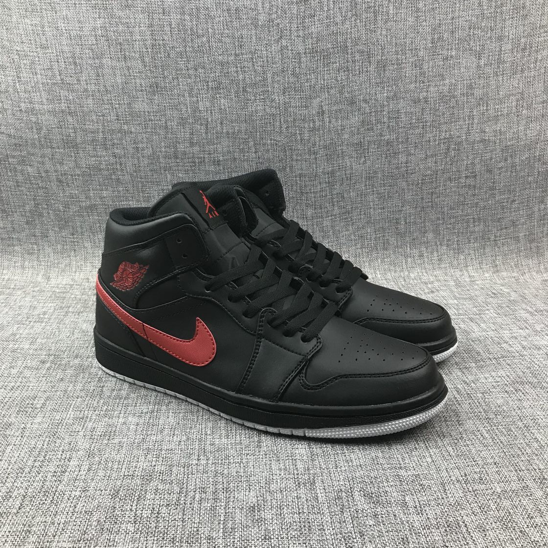 Air Jordan 1 Mid Sneakers in Black and Red 554724-045 - product image from the listing.