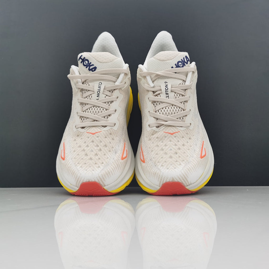 Cream and Yellow HOKA Clifton 9 Running Shoes - product image from the listing.