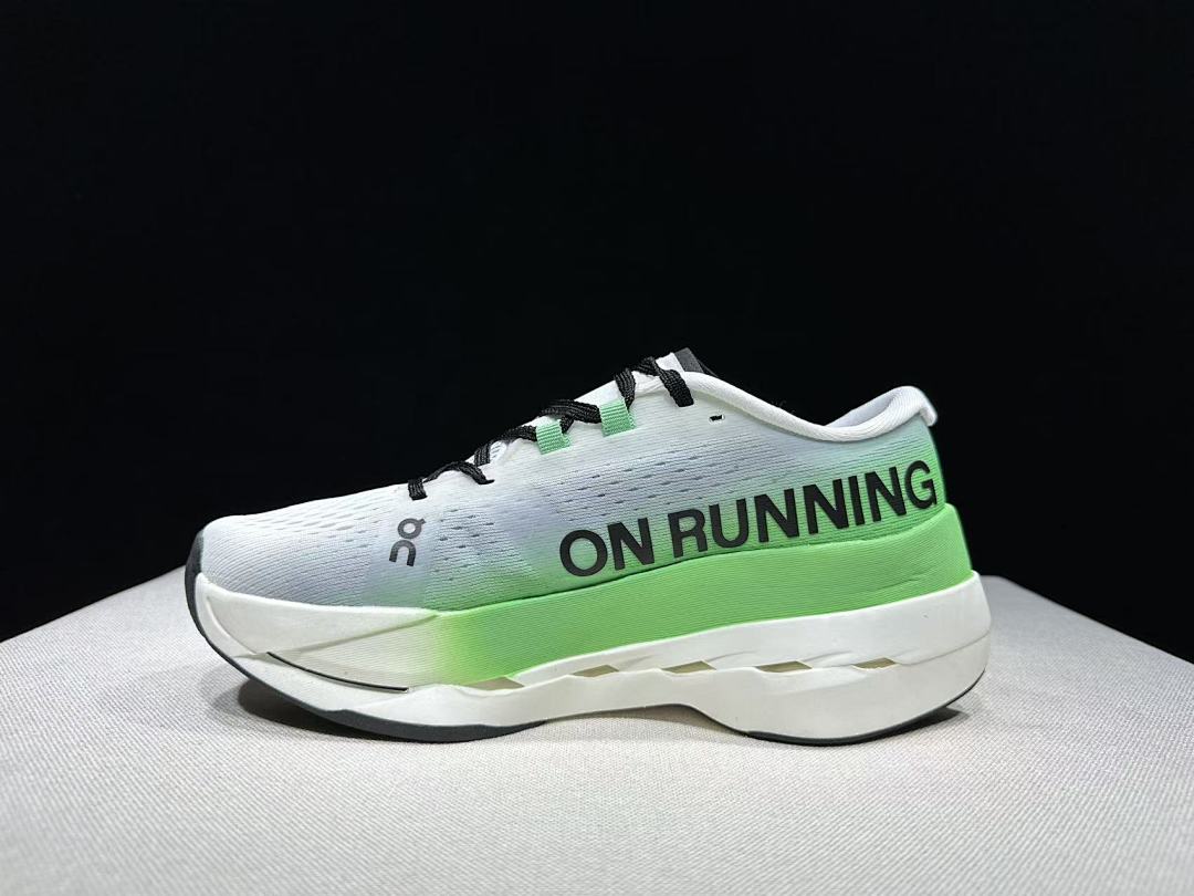 On Cloudboom Max Running Shoes, in White and Green - product image from the listing.
