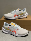 Nike Air Zoom Pegasus 40 Running Shoes in White Blue Orange DV3854-102 - product image from the listing.