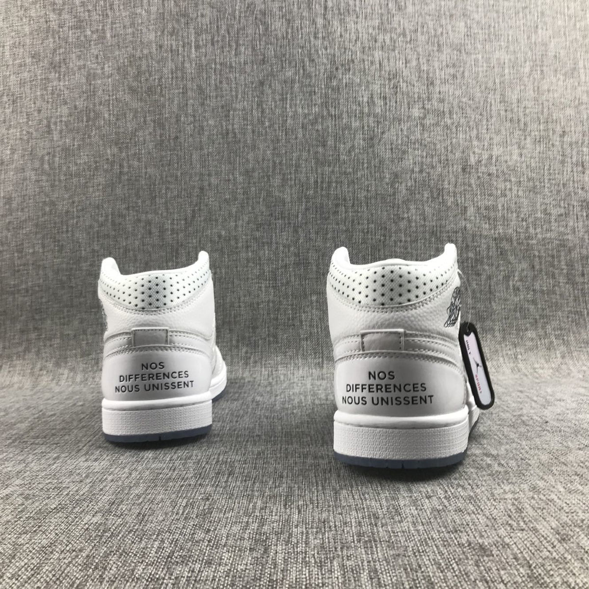 Air Jordan 1 Mid Unite Totale Sneakers in White CI9100-100 - product image from the listing.