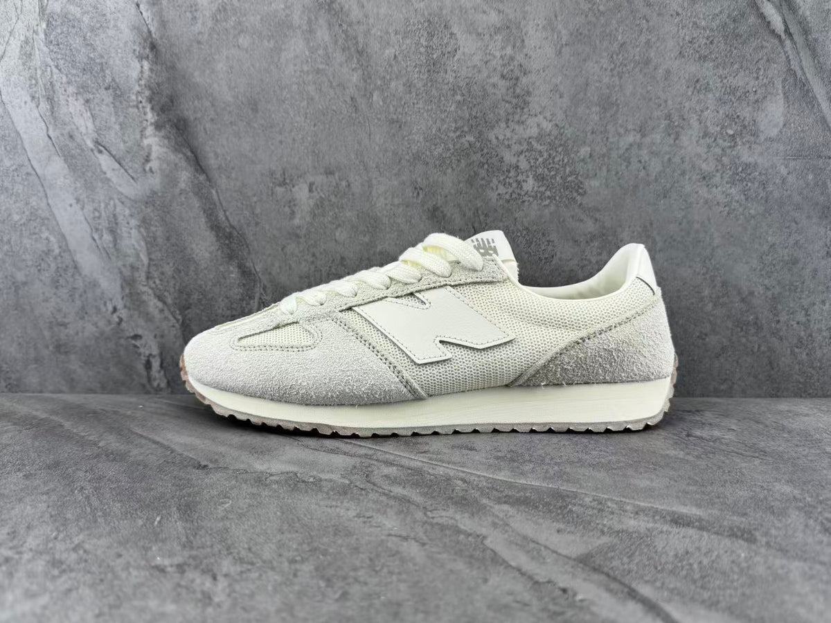 Cream and Light Gray New Balance Low-Top Sneakers - product image from the listing.