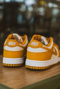 Nike Dunk Low Next Nature Sneakers in White and Brown DN1431-001 - product image from the listing.