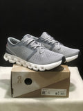 On Cloud X 4 Sneakers in Alloy and in Ivory - product image from the listing.